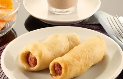 SALCHICHAS HOJALDRADAS ACOMPAÑADAS CON MILO® FRÍO